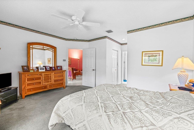 carpeted bedroom featuring a textured ceiling, crown molding, and ceiling fan