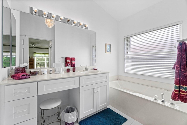 bathroom with tile patterned floors, vanity, and a bathing tub