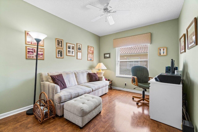 office with ceiling fan, hardwood / wood-style flooring, and a textured ceiling