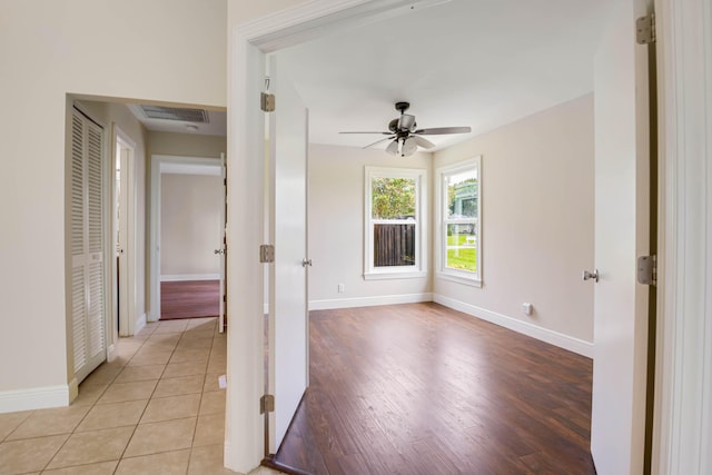 interior space featuring ceiling fan and light tile patterned floors