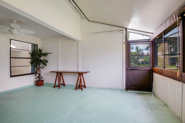 unfurnished sunroom with ceiling fan and lofted ceiling