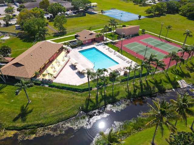 birds eye view of property with a water view