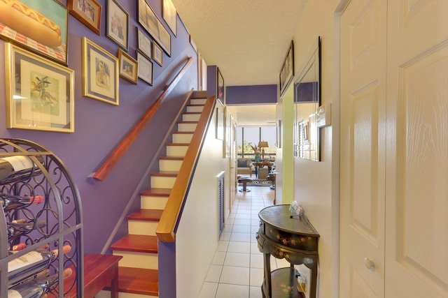 1401 S Federal Hwy Unit 411, Boca Raton, FL 33432 - stairway with tile patterned flooring and a textured ceiling