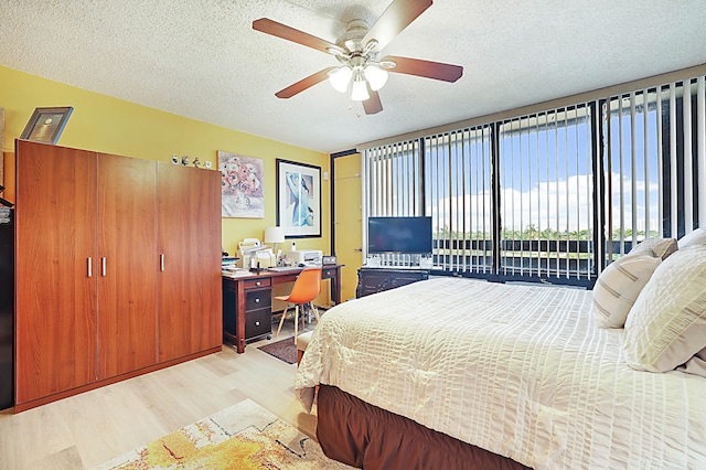 1401 S Federal Hwy Unit 411, Boca Raton, FL 33432 - bedroom with light wood-style flooring, a textured ceiling, ceiling fan, and access to outside