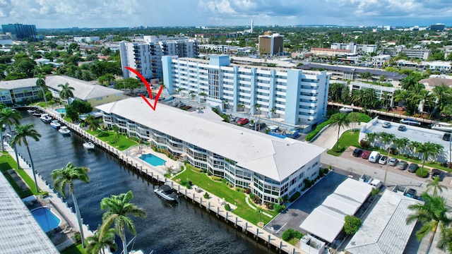 birds eye view of property with a water view