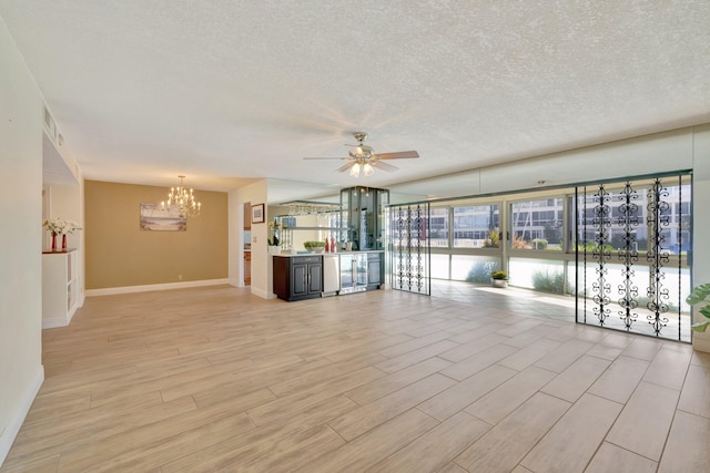 unfurnished living room featuring light hardwood / wood-style flooring, a textured ceiling, and ceiling fan with notable chandelier