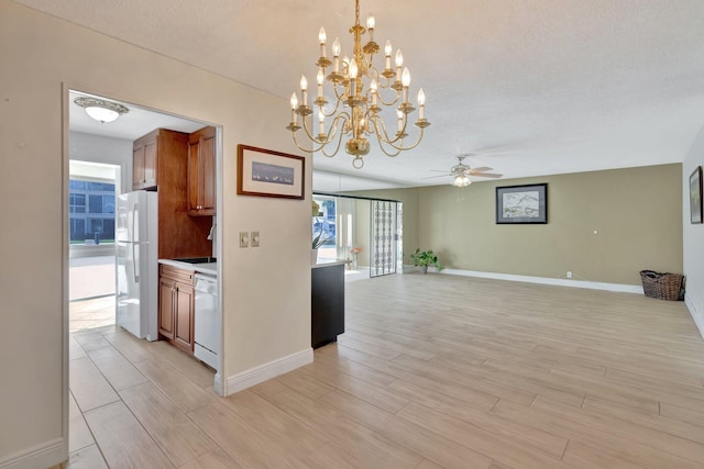 kitchen featuring light hardwood / wood-style floors, decorative light fixtures, white appliances, and ceiling fan