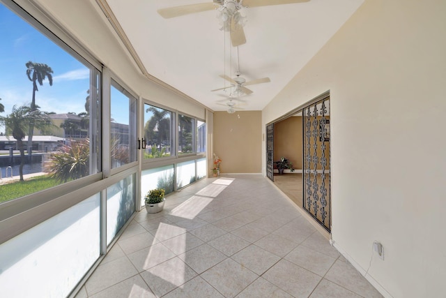 sunroom / solarium featuring ceiling fan and lofted ceiling