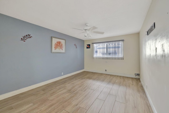 empty room featuring ceiling fan and light wood-type flooring