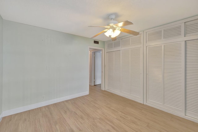 unfurnished bedroom featuring a closet, ceiling fan, and light hardwood / wood-style floors