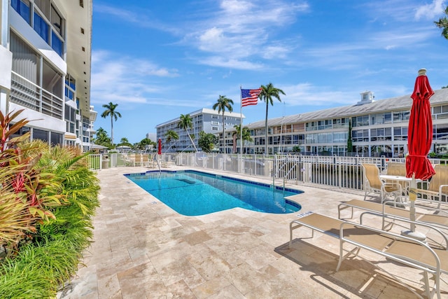 view of swimming pool with a patio area