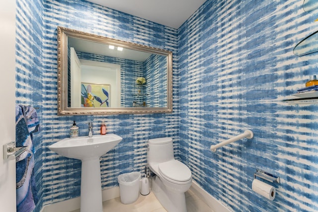 5000 N Ocean Dr Unit 1003, Singer Island, FL 33404 - bathroom with toilet, wallpapered walls, and tile patterned flooring