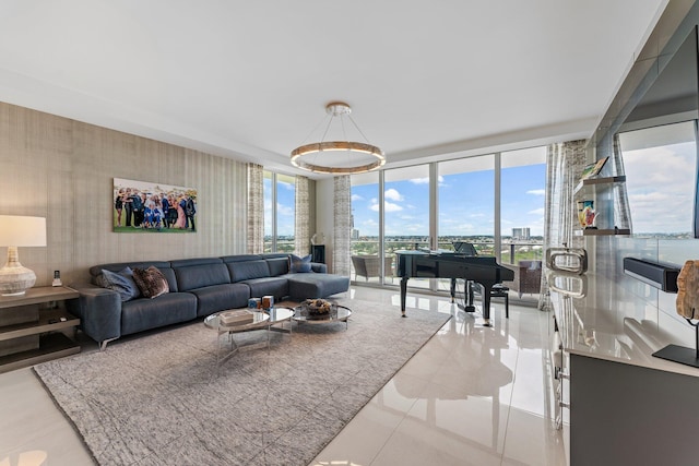 tiled living room featuring floor to ceiling windows and a chandelier