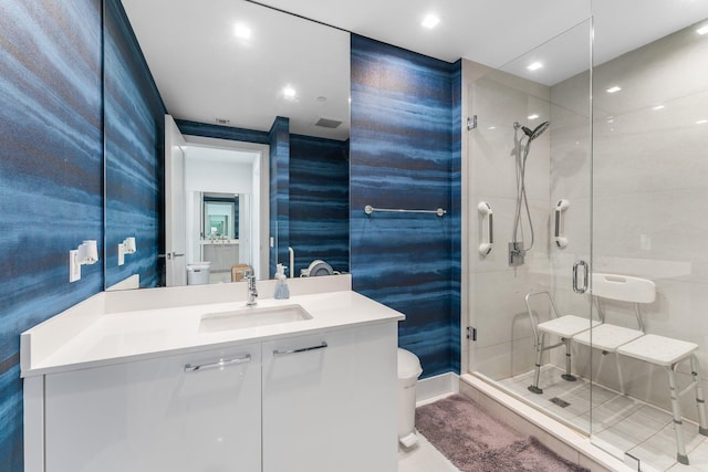 5000 N Ocean Dr Unit 1003, Singer Island, FL 33404 - full bath with toilet, a shower stall, vanity, and recessed lighting