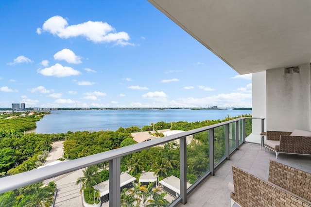 balcony featuring a water view