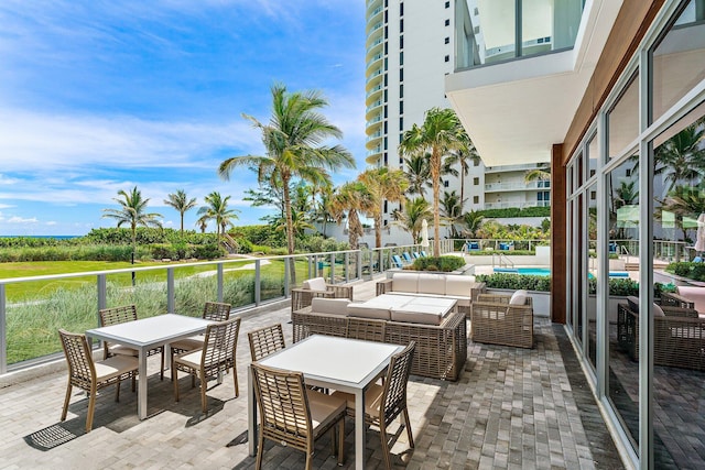 view of patio with a swimming pool and outdoor lounge area