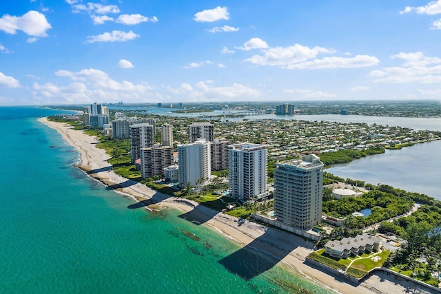 drone / aerial view featuring a view of the beach and a water view