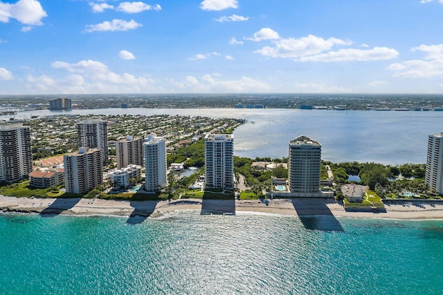 drone / aerial view featuring a view of the beach and a water view