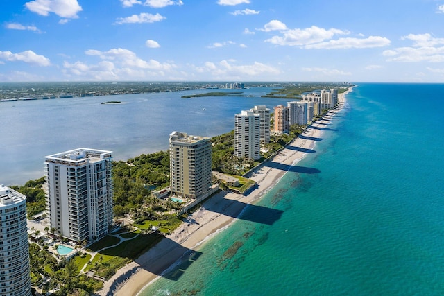 bird's eye view featuring a water view and a beach view