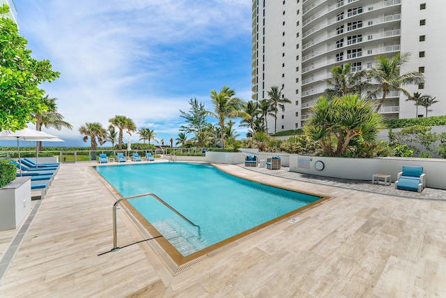 view of swimming pool with a patio area