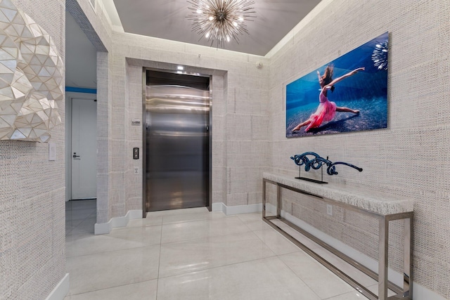 5000 N Ocean Dr Unit 1003, Singer Island, FL 33404 - corridor with elevator, tile patterned floors, and a chandelier