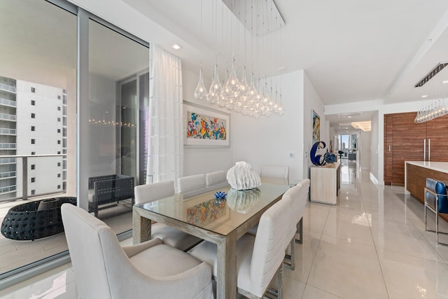 dining space featuring light tile patterned floors