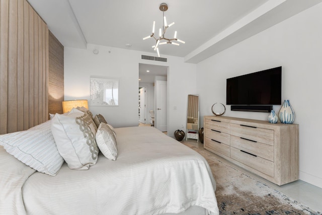 bedroom with a notable chandelier