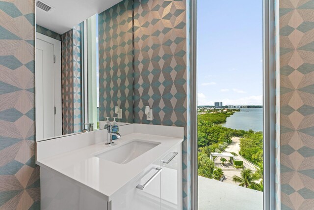 bathroom featuring a water view and vanity