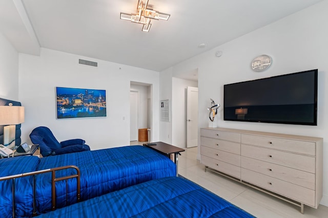 bedroom featuring light tile patterned flooring