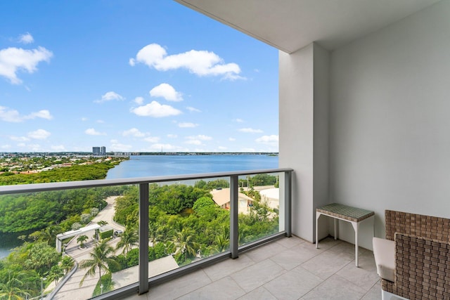 balcony featuring a water view