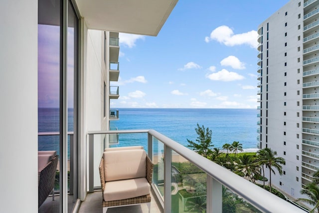 balcony featuring a water view