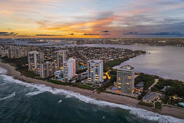 aerial view at dusk with a water view