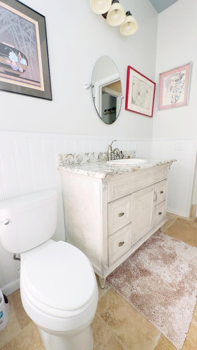 bathroom with tile patterned floors, vanity, and toilet