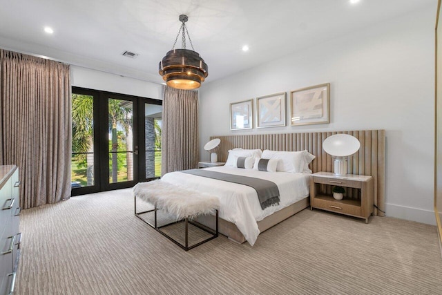 carpeted bedroom with french doors