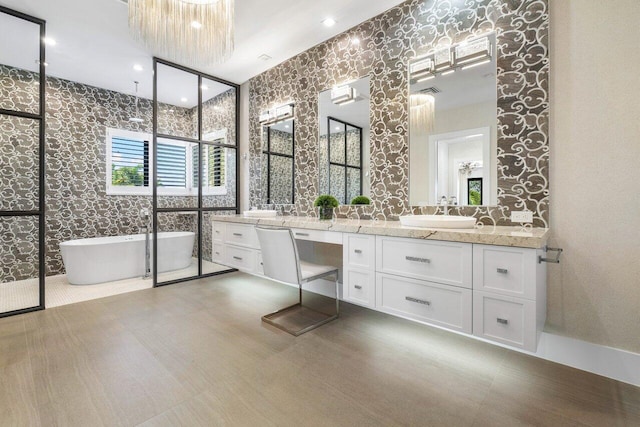 bathroom with vanity and a bathing tub