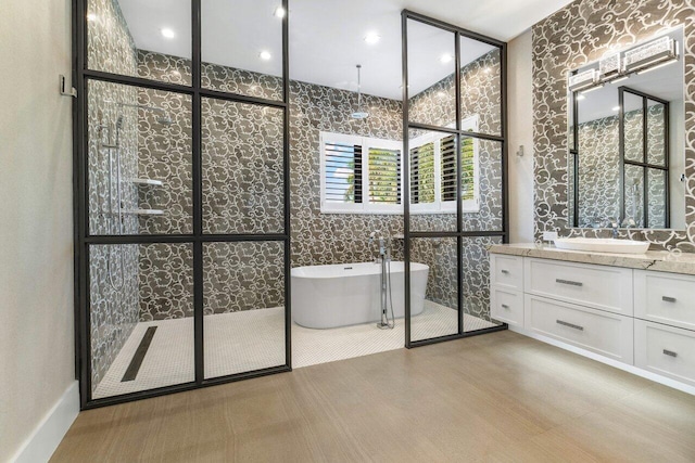 bathroom featuring a tub and vanity