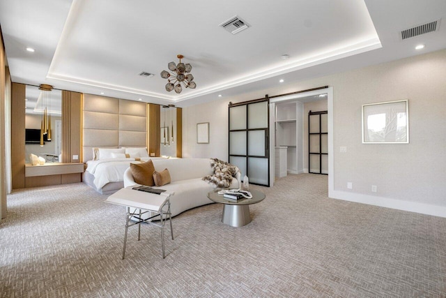 unfurnished bedroom with a barn door, light colored carpet, and a tray ceiling