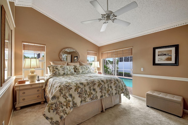 bedroom with vaulted ceiling, a textured ceiling, crown molding, ceiling fan, and light carpet