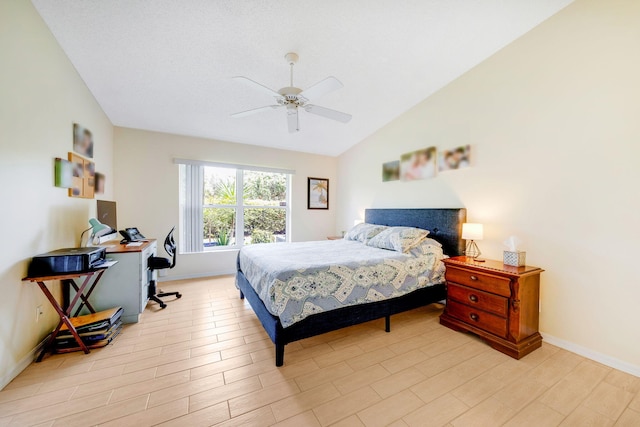 bedroom with light wood-type flooring, vaulted ceiling, and ceiling fan