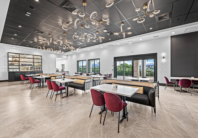 dining space with a high ceiling