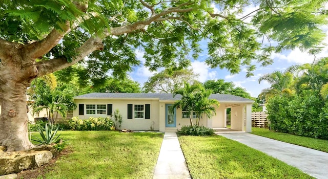 ranch-style house with a front lawn