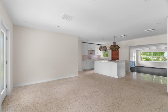 unfurnished living room with sink