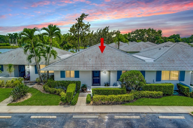 ranch-style house with a lawn