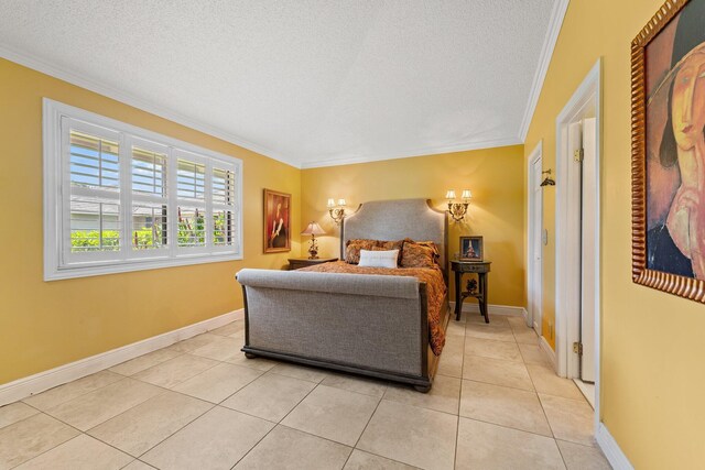 bedroom with light tile patterned floors, a textured ceiling, and ornamental molding