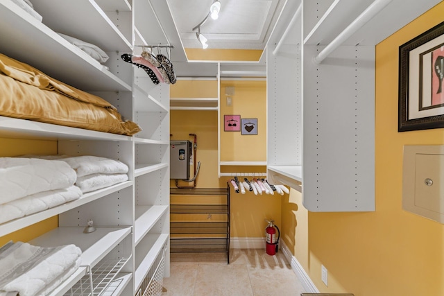 119 Club Dr, Palm Beach Gardens, FL 33418 - walk in closet featuring tile patterned flooring
