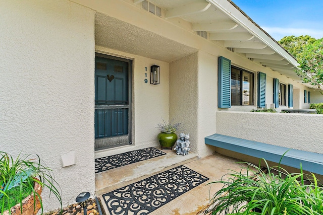 119 Club Dr, Palm Beach Gardens, FL 33418 - entrance to property featuring stucco siding