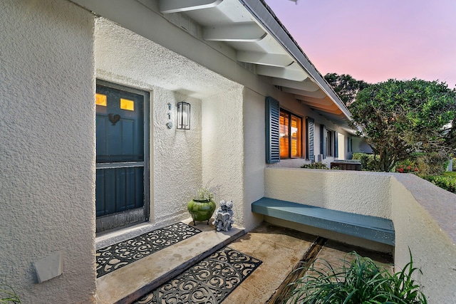 119 Club Dr, Palm Beach Gardens, FL 33418 - doorway to property with stucco siding and a balcony