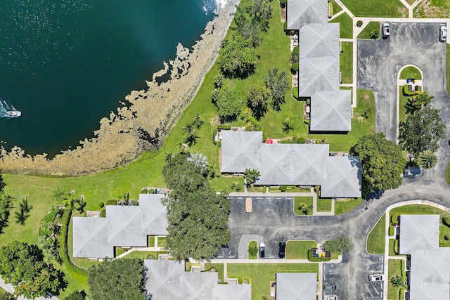 birds eye view of property with a water view