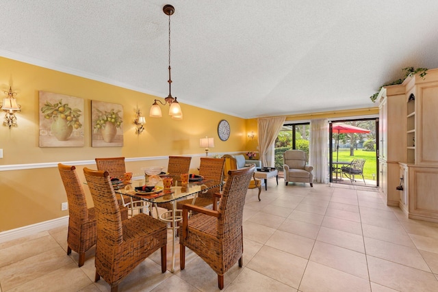 119 Club Dr, Palm Beach Gardens, FL 33418 - dining room with light tile patterned floors, a textured ceiling, crown molding, and vaulted ceiling