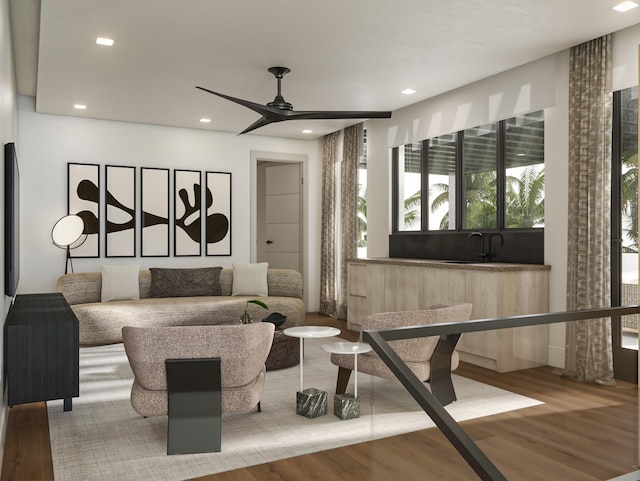 living room with ceiling fan and hardwood / wood-style flooring